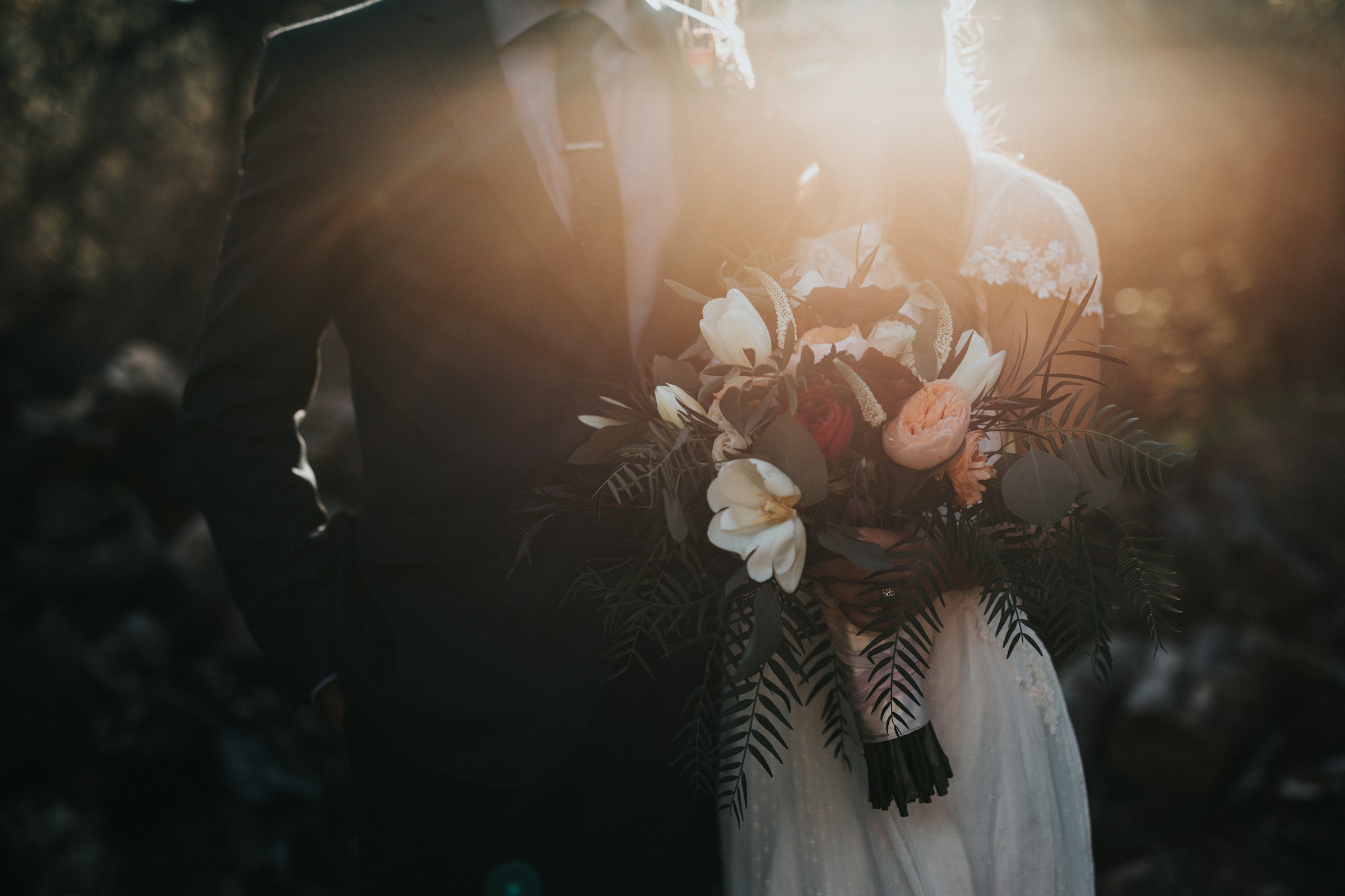 Elegant wedding couple holding hands